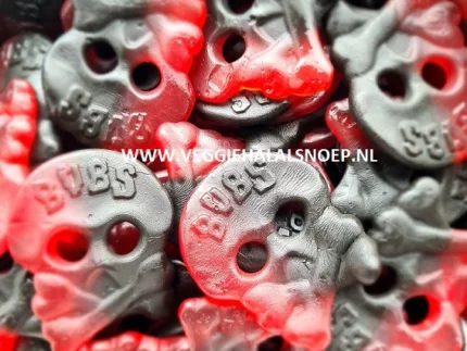 Een close-up afbeelding van een smakelijke portie Bubs Framboos Drop, met glanzende roze en paarse dropsnoepjes.